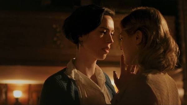 Elizabeth touches Olive's lips as she's about to kiss her.